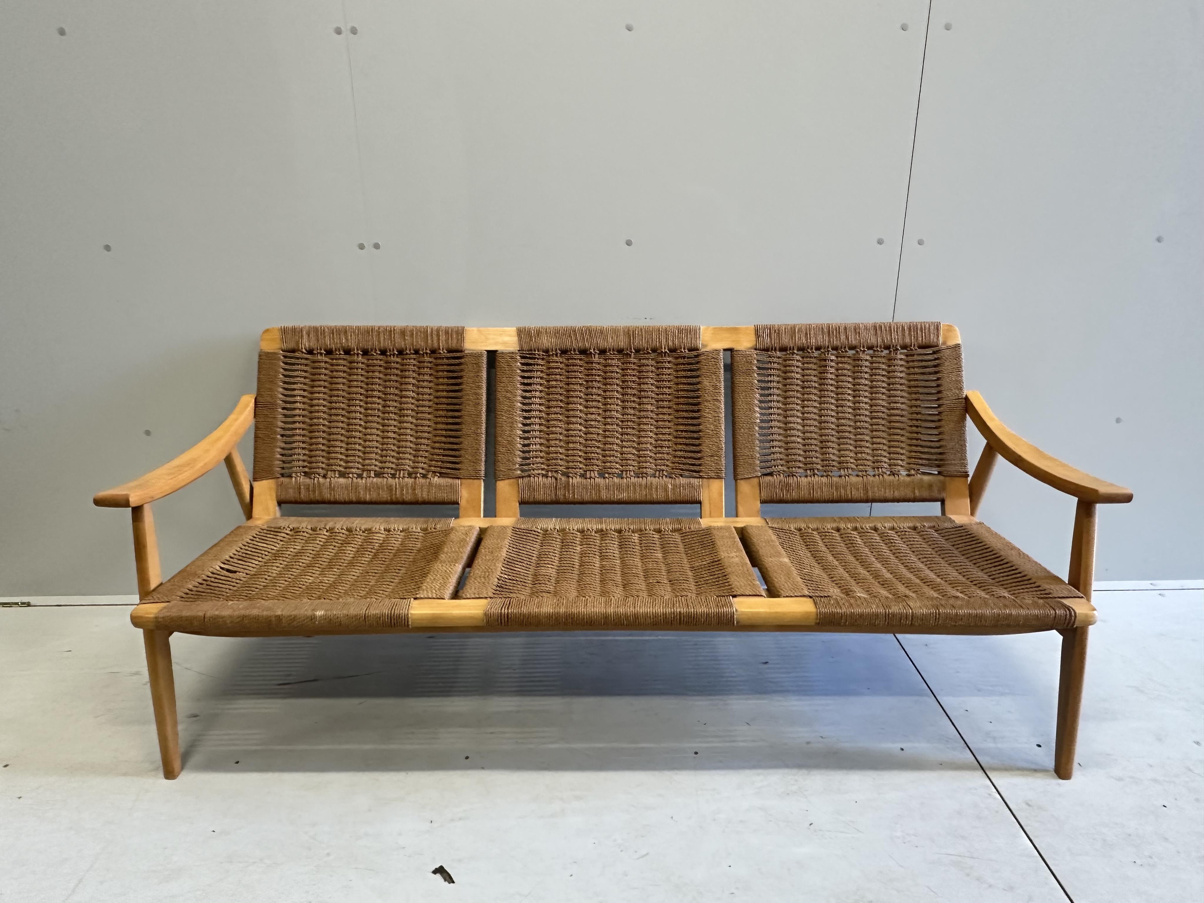 A mid century caned teak three piece lounge suite, settee width 174cm, depth 68cm, height 71cm. Condition - good